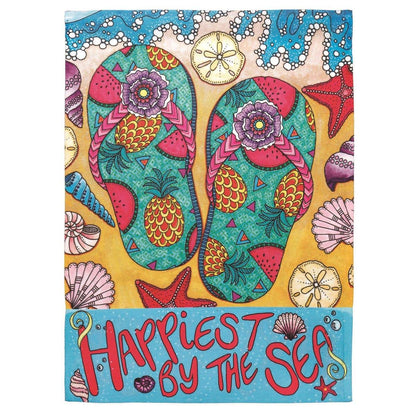 Tropical Paradise 30x44 banner flag, coastal printed design with palm-inspired artwork and ocean hues, displayed outdoors on a house pole by a front porch.