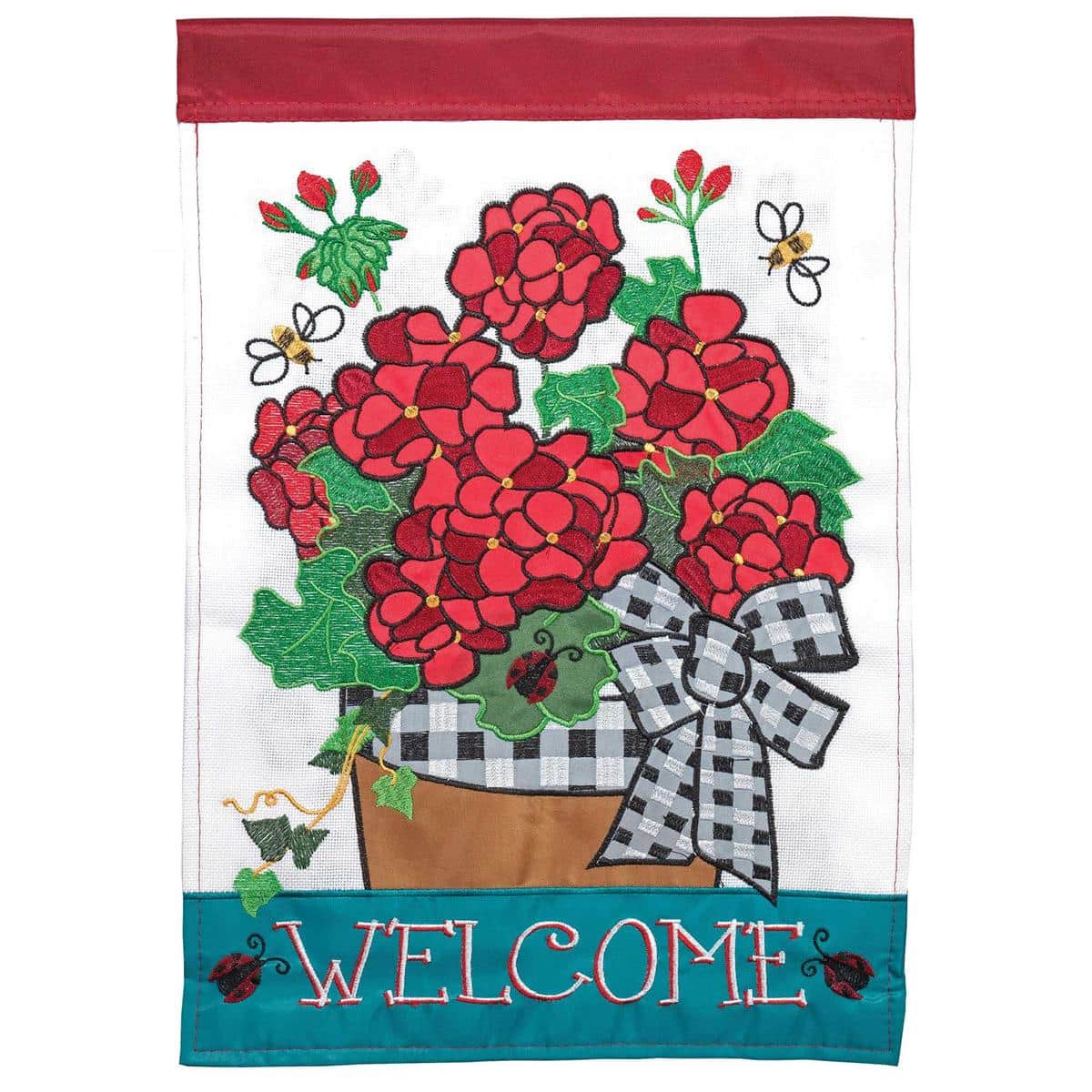 13x18 Welcome Geraniums Burlap Garden Flag showing layered applique geranium flowers, rustic burlap texture and 'Welcome' lettering, displayed on a garden flag stand for porch or yard.