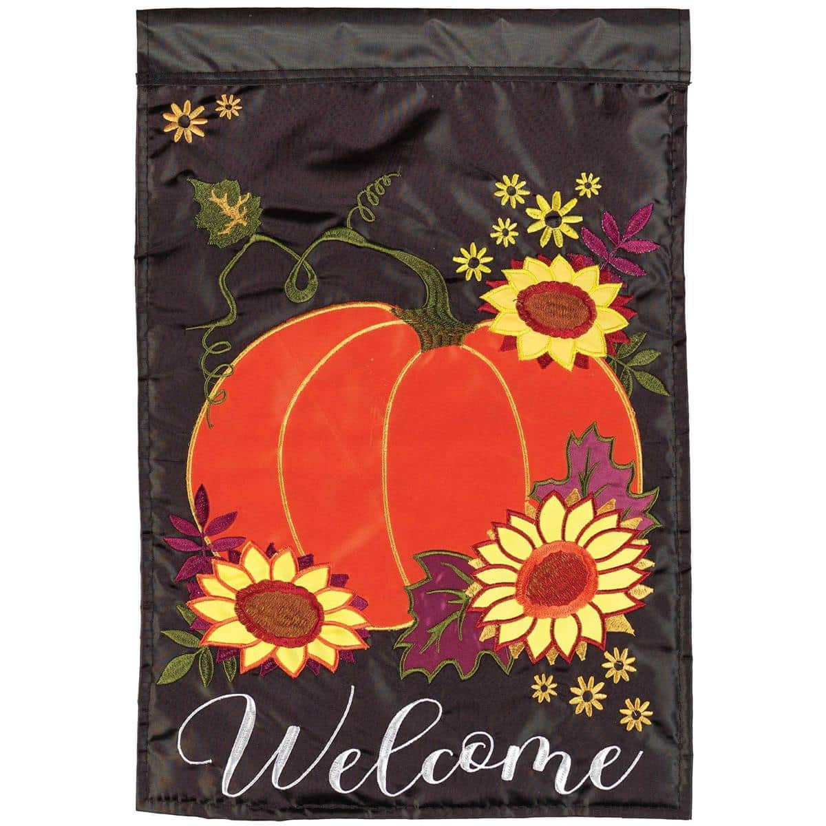 Close-up of 13x18 Welcome Pumpkin Garden Flag with layered double applique pumpkins, autumn leaves, stitched Welcome text, shown on a porch flagpole beside seasonal mums and a step.