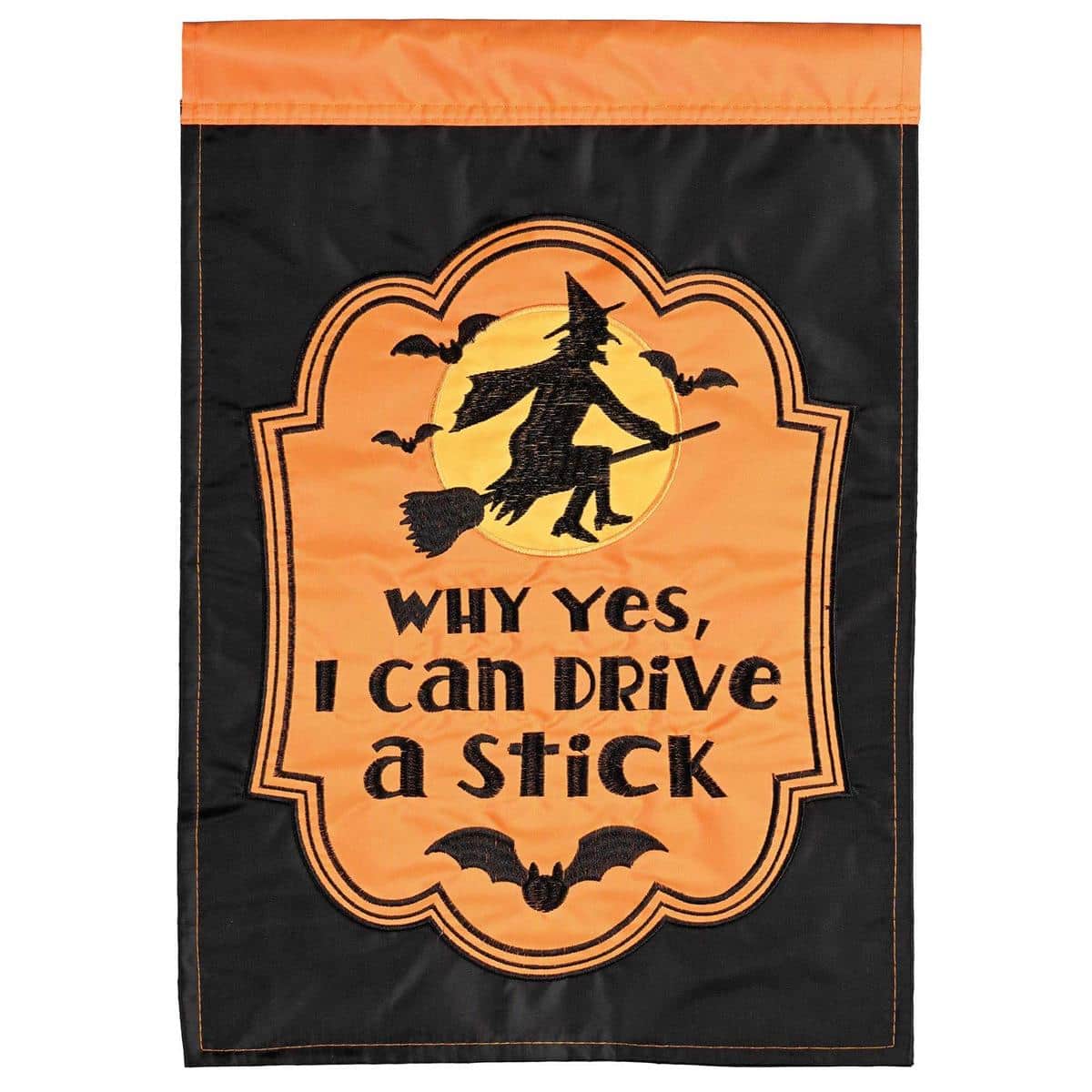 29x42 Halloween banner flag reading "Witch Yes I Can Drive A Stick" with layered applique witch graphic flying on broomstick against a dark background, shown mounted on a garden banner pole