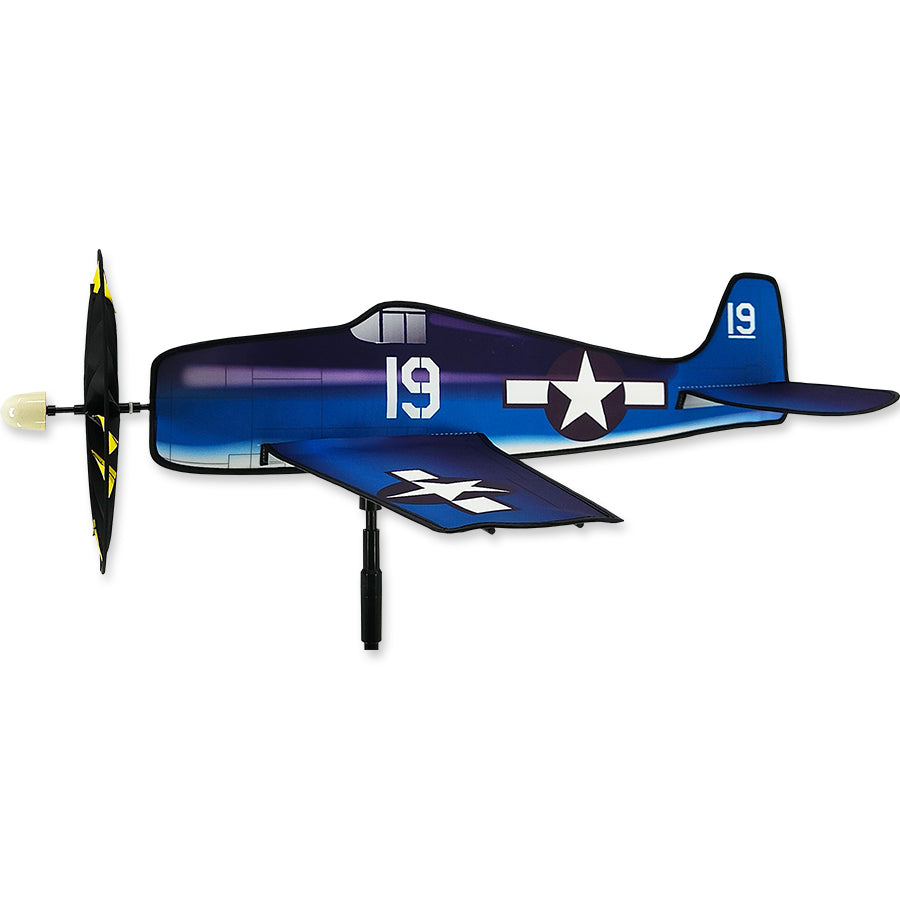 Airplane Spinner - Hell Cat, a colorful garden ornament featuring a vintage aircraft design, spinning gracefully in a backyard setting amidst greenery.