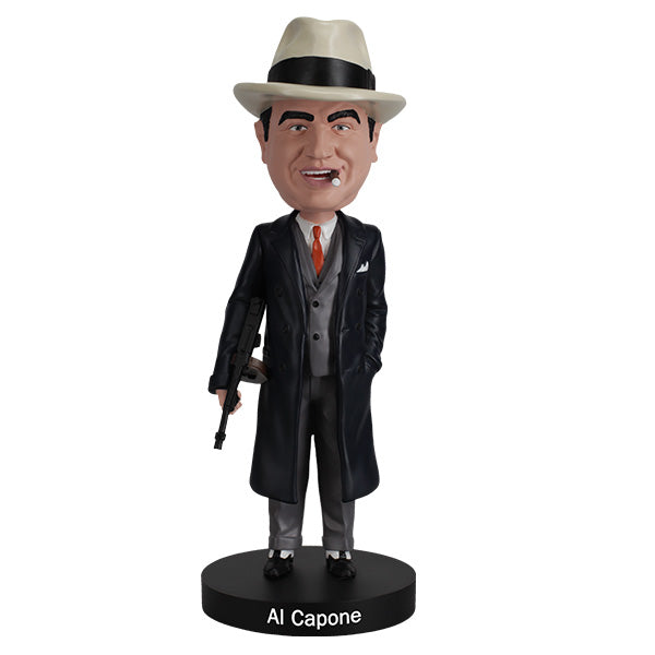Al Capone Bobblehead standing 8 inches tall, featuring lifelike details, displayed on a shelf with a vintage theme in the background.
