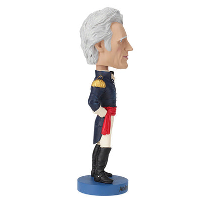 Andrew Jackson v2 Bobblehead crafted from heavyweight polyresin, featuring hand-painted details, displayed on a collector's shelf with a background of books.