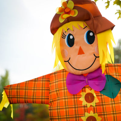 Autumn Scarecrow Wind Friend with vibrant colors and charming design, displayed as a windsock in a fall garden setting.