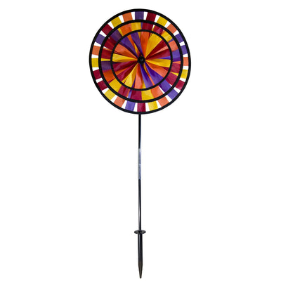 Vibrant Autumn Triple Wheel Spinner featuring three colorful wheels dancing in the wind, showcasing fall hues of red, orange, and yellow in a garden setting.