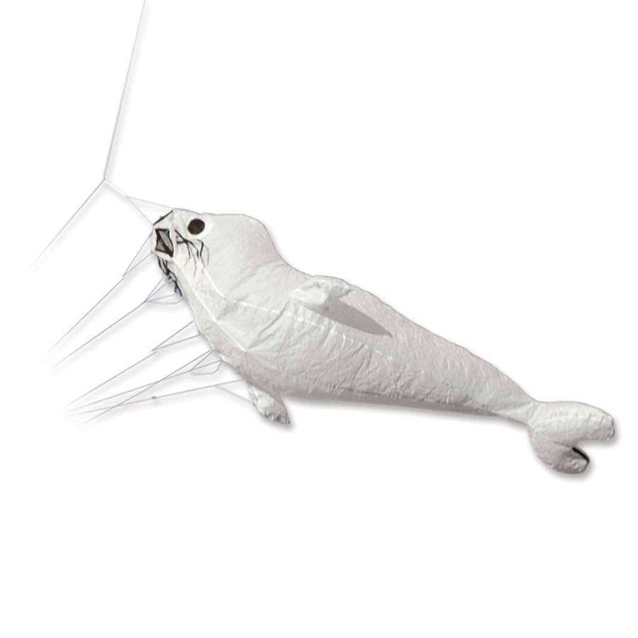 Baby Seal Kite in vibrant white colors soaring through a clear blue sky, showcasing its playful design during an outdoor festival.