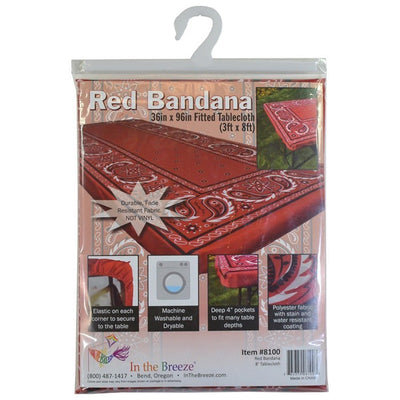 Bandana 8' Tablecloth with vibrant design displayed on a picnic table in a sunny outdoor setting, secured with deep pockets.