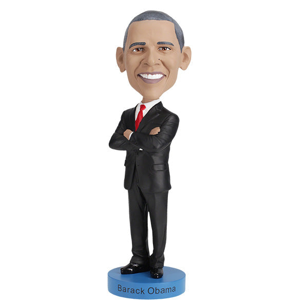 Barack Obama bobblehead, a hand-painted collectible figure showcasing the likeness of the first African American president, displayed against a neutral background.