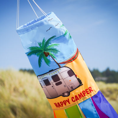 Colorful Beach Camping 40-inch Windsock featuring vibrant applique design hung outdoors, waving in the breeze above the ground.