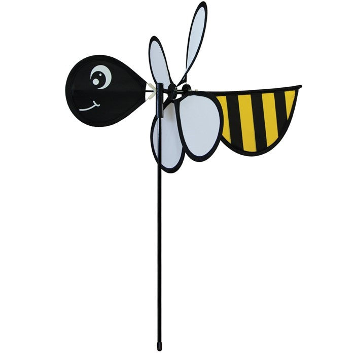 Bee Baby Spinner with colorful 12-inch wheel and bee design, elegantly spinning in a sunny garden setting on a fiberglass pole.
