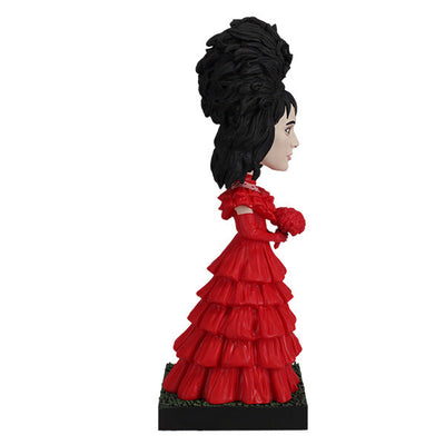 Beetlejuice Lydia Deetz Bobblehead standing 8.25 inches tall, featuring intricate details of her Red Wedding Dress, showcasing gothic elegance.