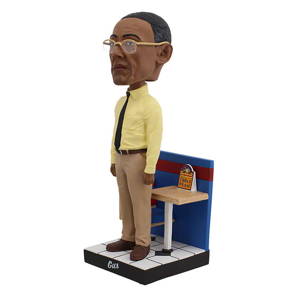 Better Call Saul Gus Fring Bobblehead standing 8 inches tall with meticulous detail, dressed in a suit, ideal for display in a collector's setting.