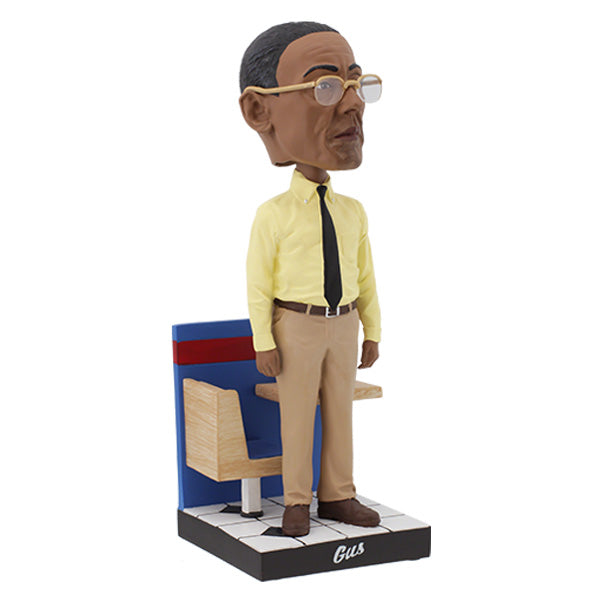 Better Call Saul Gus Fring Bobblehead standing 8 inches tall with meticulous detail, dressed in a suit, ideal for display in a collector's setting.