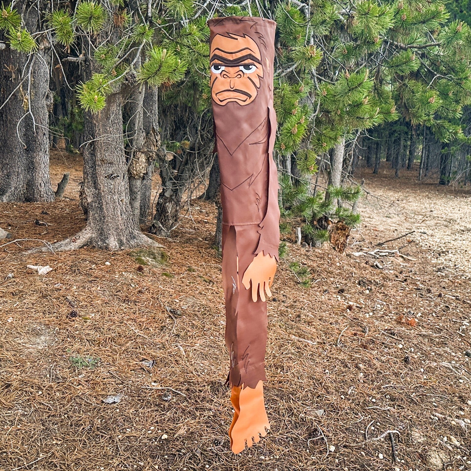 Bigfoot 50" Breeze Buddy windsock swaying in the outdoor breeze, showing its playful design and embroidered details, perfect for outdoor decor.