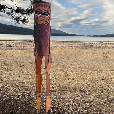 Bigfoot 50" Breeze Buddy windsock swaying in the outdoor breeze, showing its playful design and embroidered details, perfect for outdoor decor.