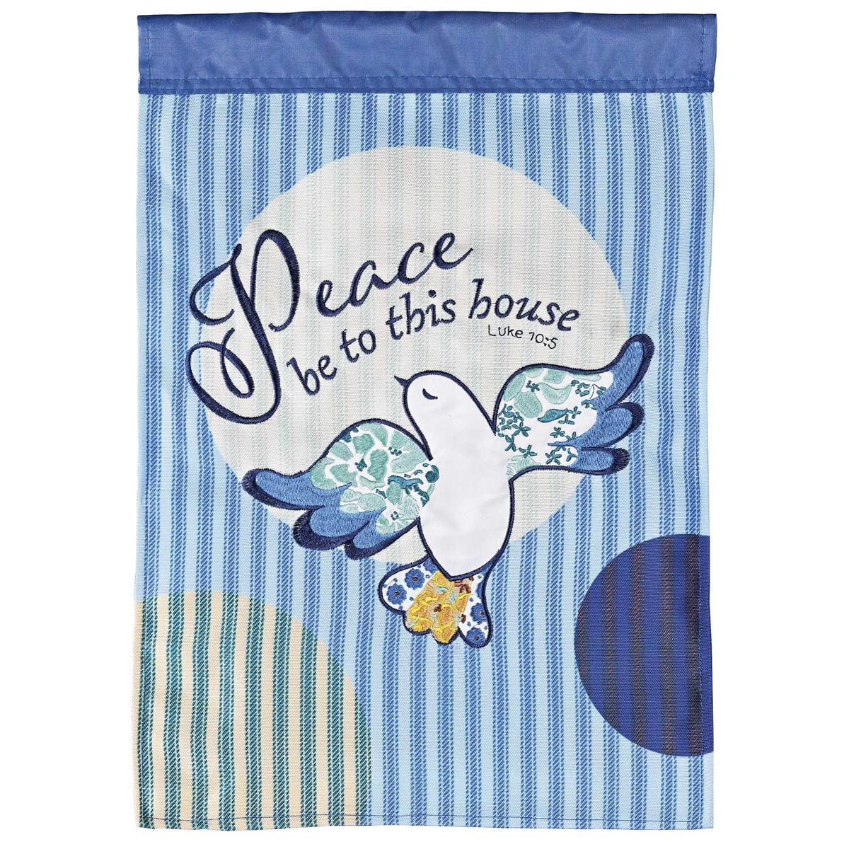 Bird Peace Be To This House double-sided garden flag featuring intricate fabric appliques and embroidery, displayed on a pole in a garden setting.