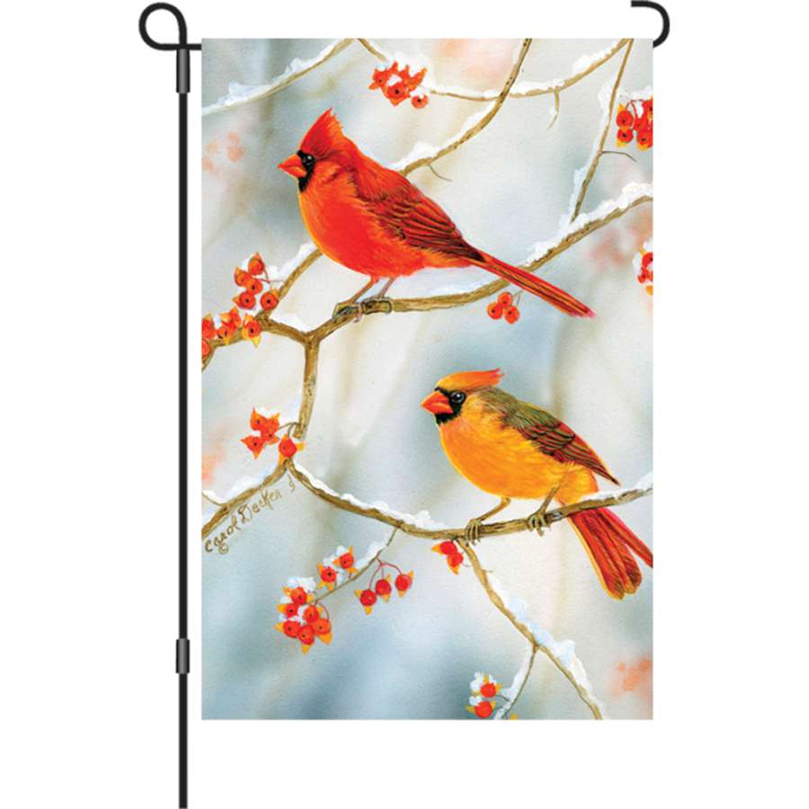 12 in. Bittersweet Cardinals garden flag featuring beautiful cardinals and bittersweet leaves, displayed outdoors in a garden setting.