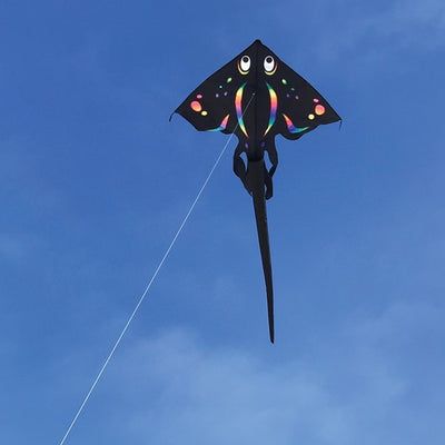 Black Stingray Kite soaring high with a 6-foot wingspan and beautiful applique design against a clear blue sky.