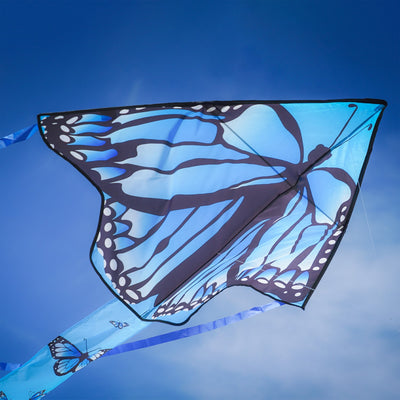 Blue Butterfly Swarm 45 inch Fly-Hi Kite soaring in the sky, showcasing a vibrant blue karner butterfly design with streamer tails.
