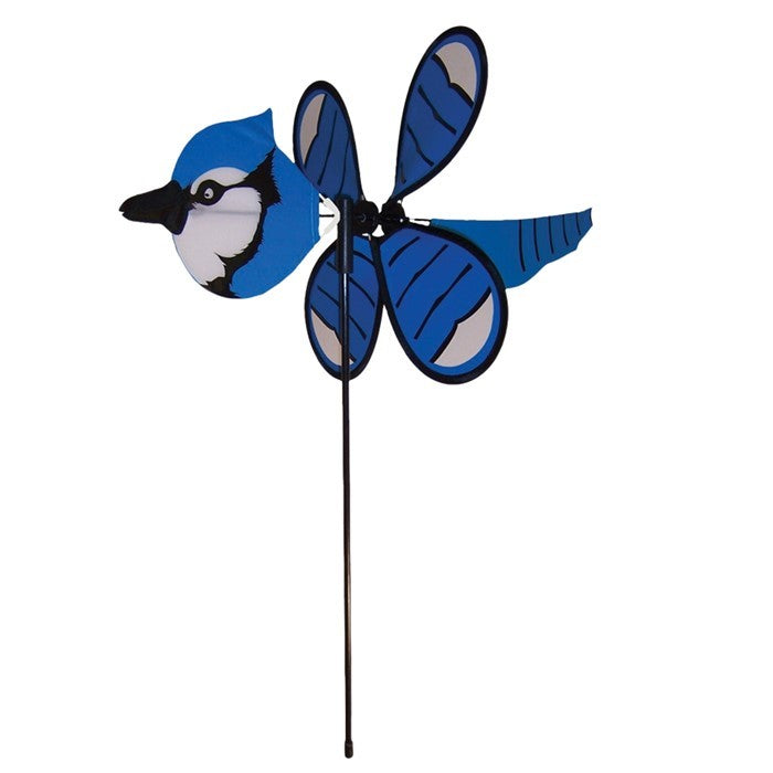 Blue Jay Baby Spinner vividly displayed in a garden setting, featuring colorful design and 12-inch spinning wheel for outdoor charm.