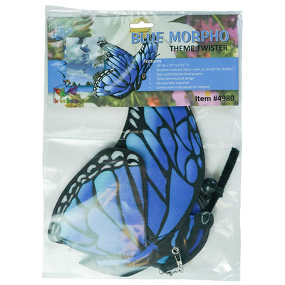 Blue Morpho Theme Twister features a vibrant 3D butterfly design with a curlie tail, spinning in the wind, enhancing a garden setting.