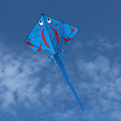 Blue Stingray Kite with vibrant applique design flying high in the sky, featuring a 6-foot wingspan and a sturdy tube tail for stability.