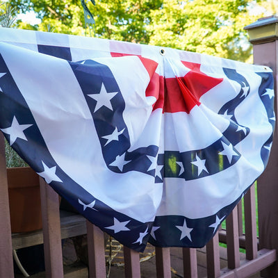 Blue Stripe Printed Bunting, featuring pleated half-circle design with brass grommets, displayed outdoors, ideal for patriotic decorations.