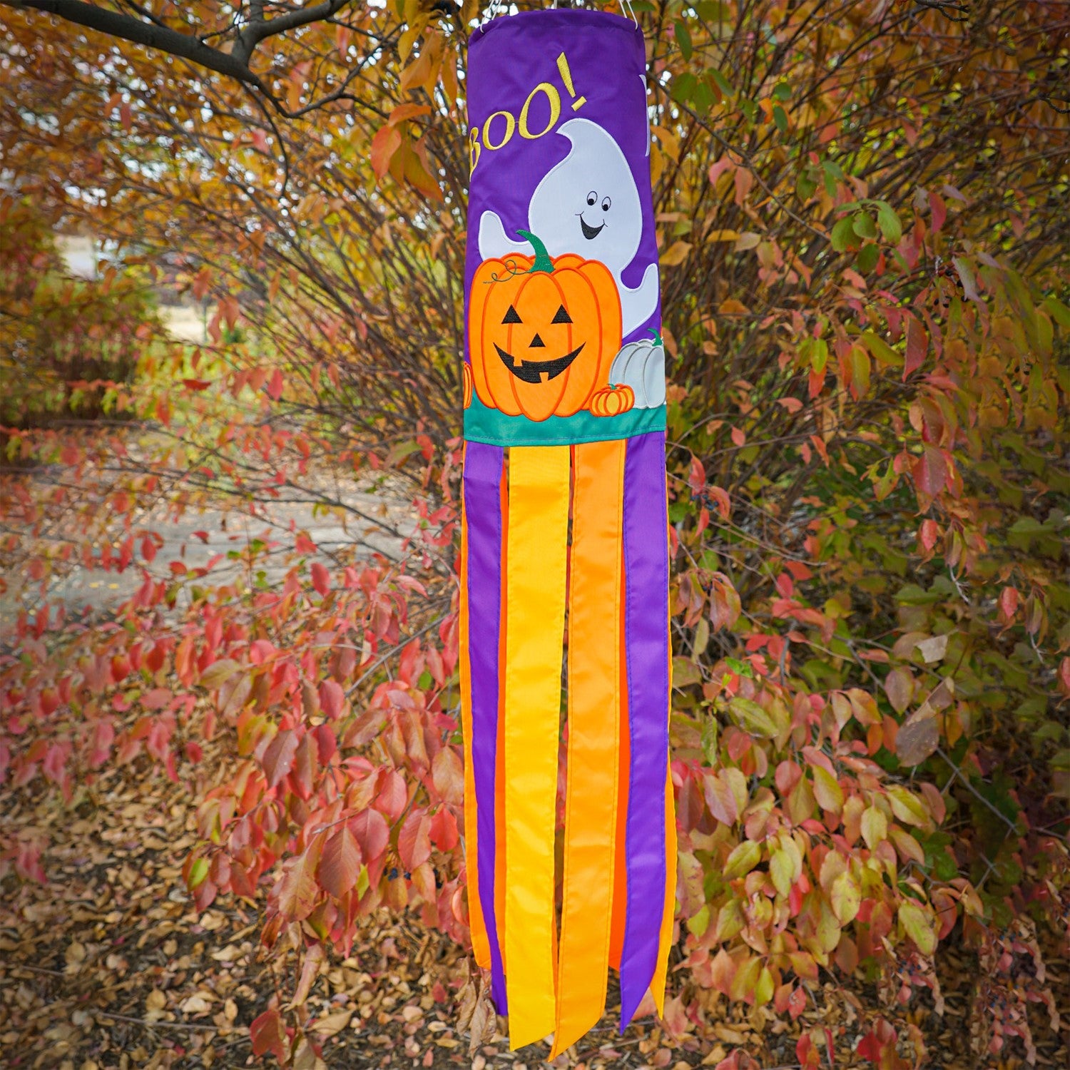BOO! Halloween 40'' windsock featuring a playful ghost design with colorful tails flapping in the breeze, perfect for outdoor Halloween decoration.