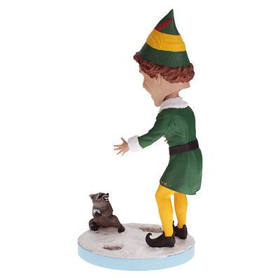 Buddy the Elf with Raccoon bobblehead standing on a shelf, showcasing vibrant colors and playful design, perfect for holiday decor.