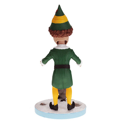 Buddy the Elf with Raccoon bobblehead standing on a shelf, showcasing vibrant colors and playful design, perfect for holiday decor.