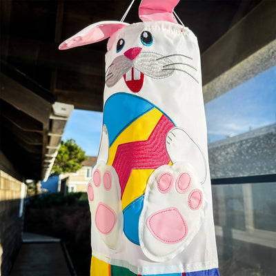 Bunny 3D Windsock in a festive garden setting, featuring vibrant colors and detailed embroidery, designed for seasonal decorations.
