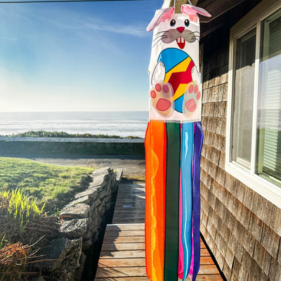 Bunny 3D Windsock in a festive garden setting, featuring vibrant colors and detailed embroidery, designed for seasonal decorations.