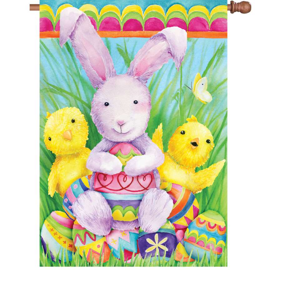 28 in. Bunny and Friends illuminated flag featuring colorful bunnies displayed outdoors, perfect for spring holiday decorations.