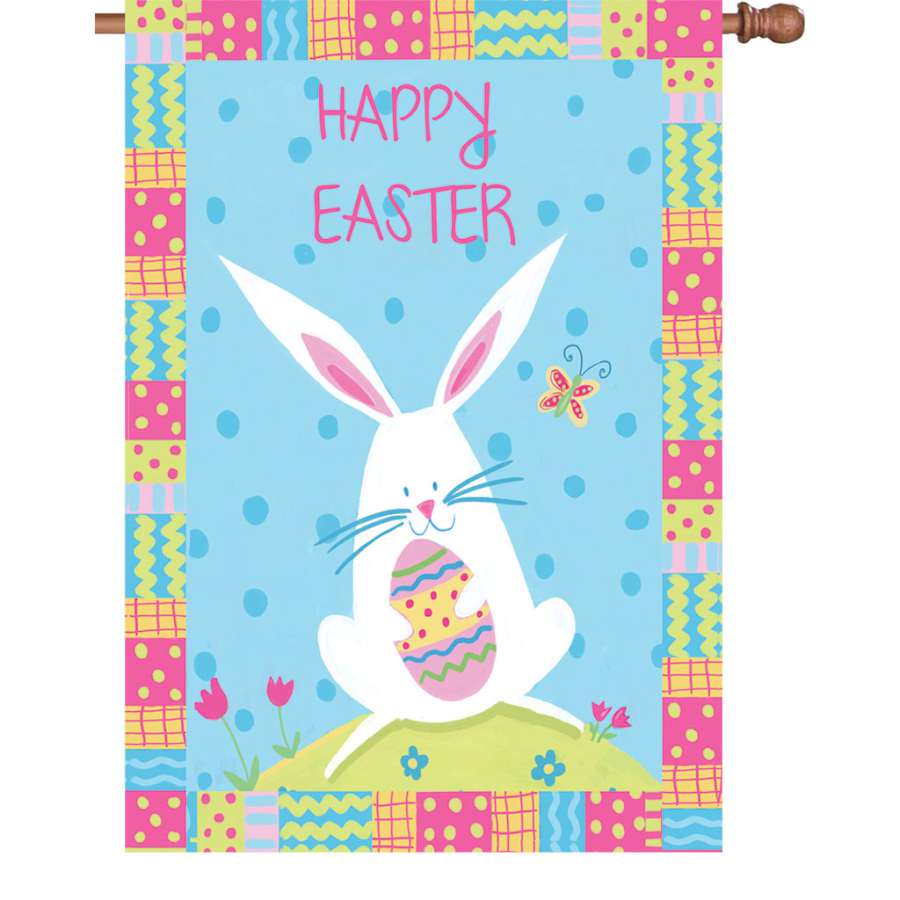 28 in. Bunny Easter flag with vibrant design featuring a whimsical bunny and 'HAPPY EASTER' text, displayed outdoors in a spring setting.