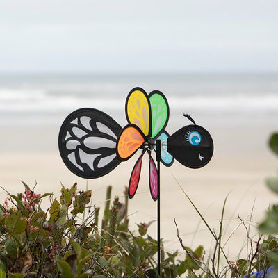 Colorful Butterfly Baby Spinner with baby butterfly design spinning on a garden pole, showcasing bright colors in a sunny outdoor setting.