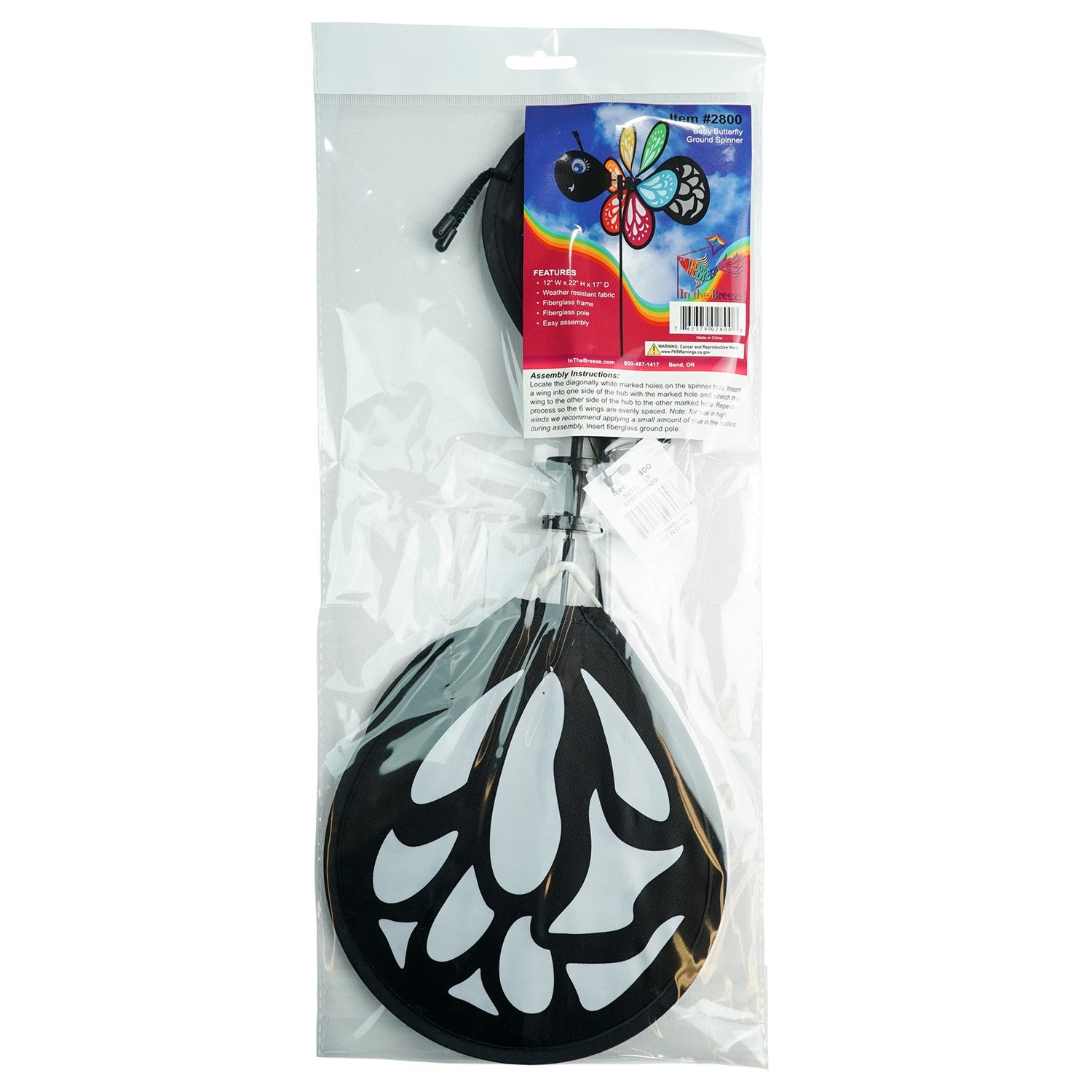 Colorful Butterfly Baby Spinner with baby butterfly design spinning on a garden pole, showcasing bright colors in a sunny outdoor setting.