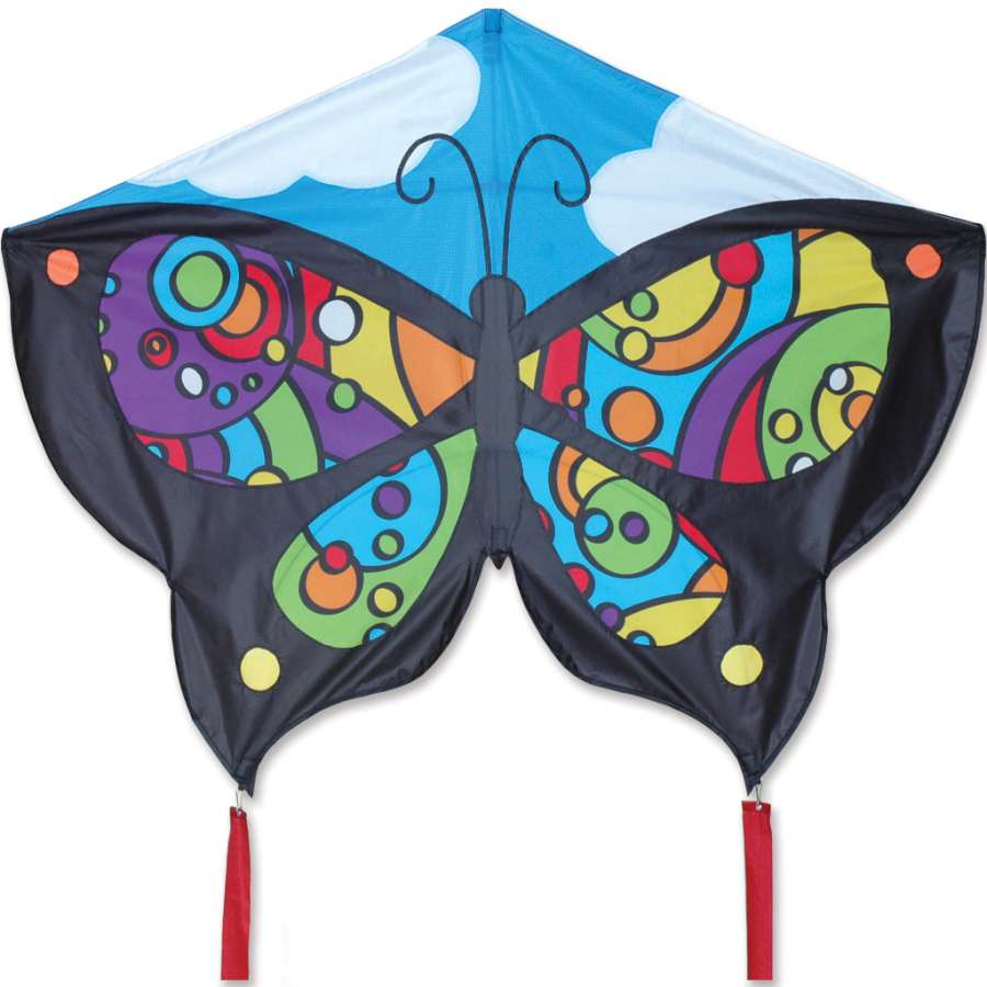 Butterfly Kite - Rainbow Orbit soaring in a clear sky, showcasing its vibrant butterfly design and ripstop polyester fabric against the sun.