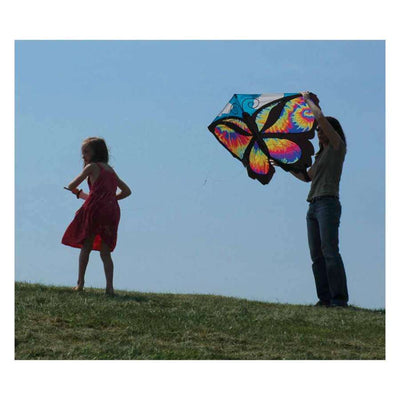 Colorful Butterfly Kite - Tie Dye, measuring 52 x 37 inches, soaring high against a blue sky, showcasing its vibrant design and details.