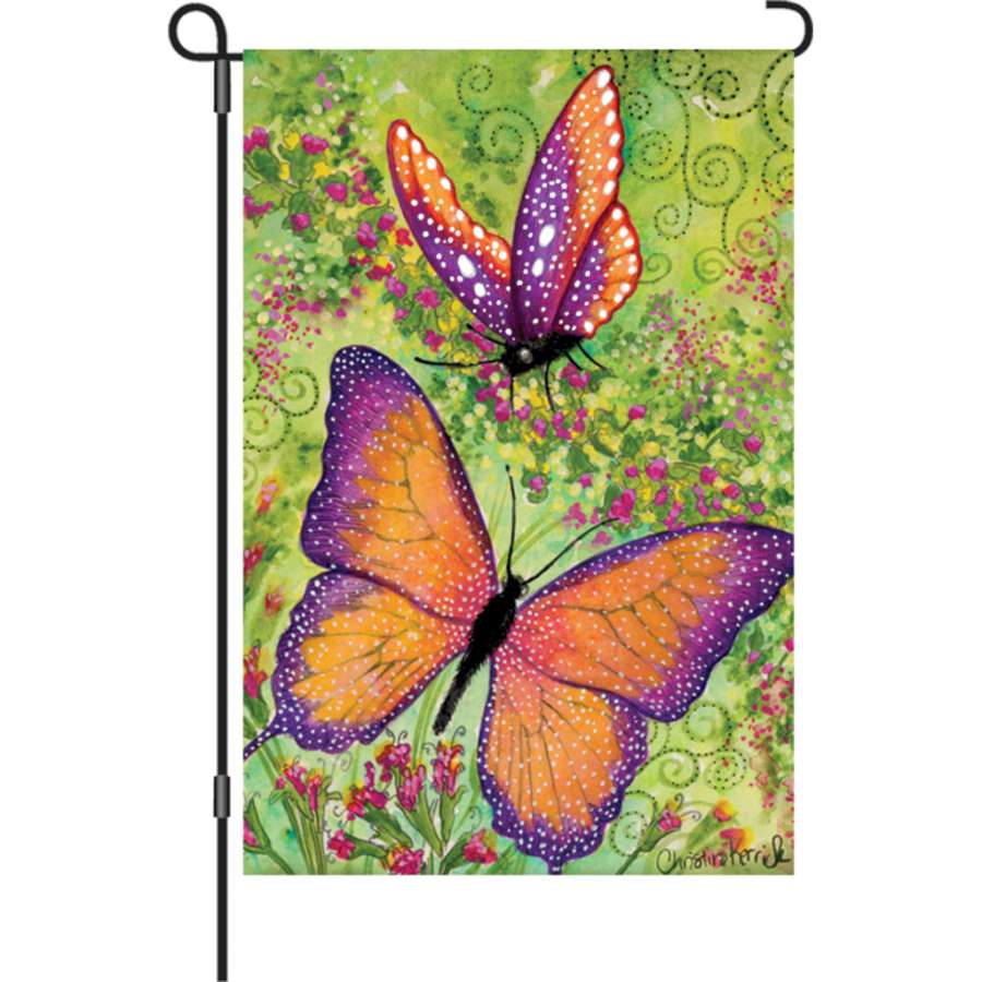 Butterfly Sparkles garden flag featuring vivid illuminated butterflies, displayed in a garden setting to brighten up any outdoor space with its charm.