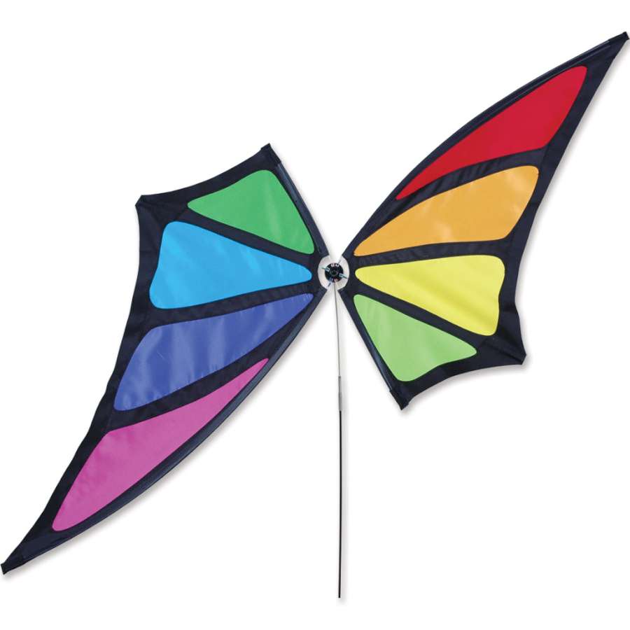 Colorful Rainbow Butterfly Spinner on an 8-foot pole gracefully dancing in the wind, adding charm to a lush garden setting.
