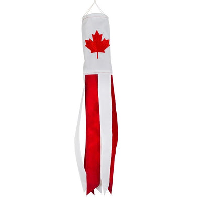 Canada 18-inch windsock displaying a bright maple leaf design, fluttering in the breeze outdoors with six colorful tails.