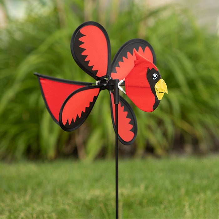 Colorful Cardinal Baby Spinner featuring a bright baby cardinal on a rotating wheel against a lush garden background.