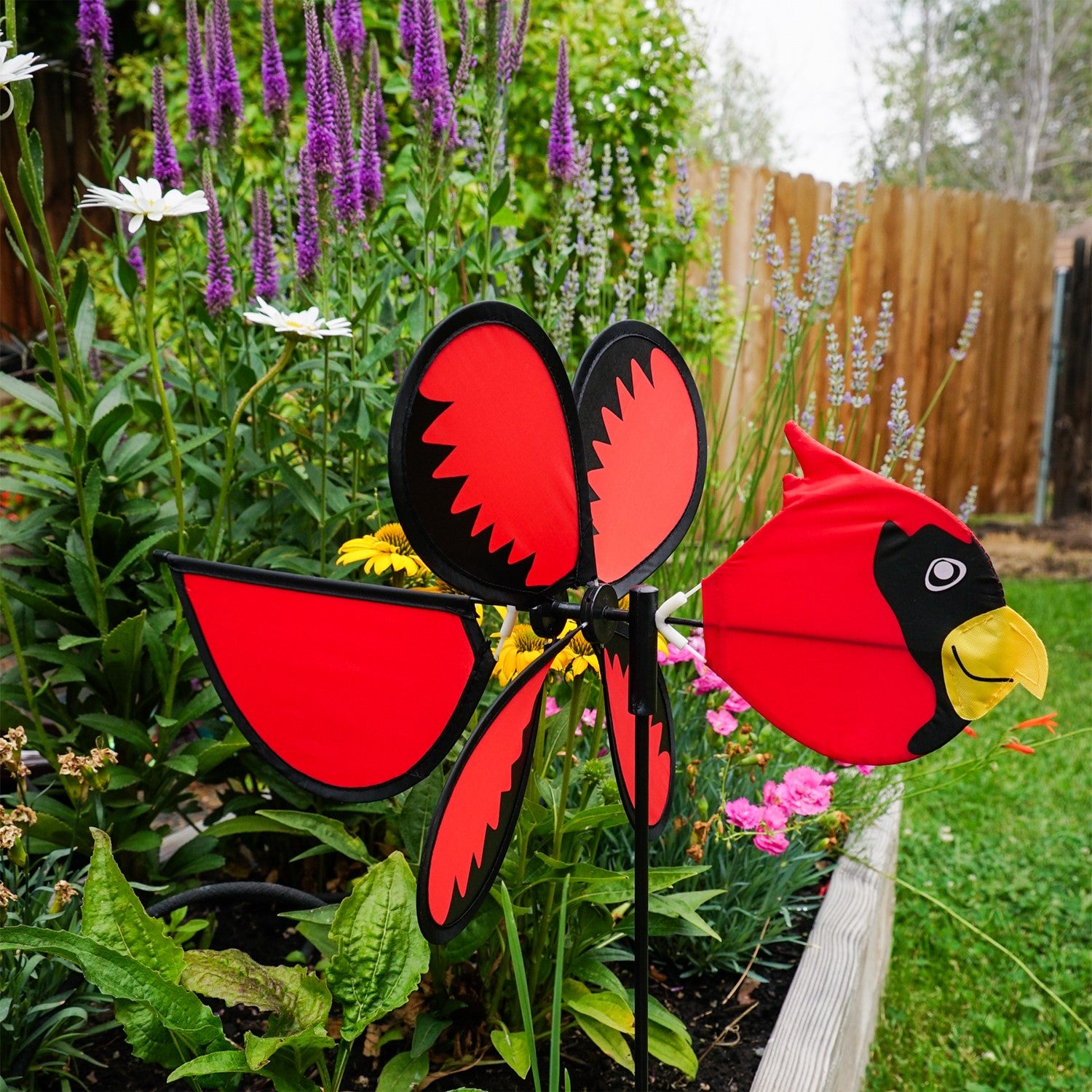 Colorful Cardinal Baby Spinner featuring a bright baby cardinal on a rotating wheel against a lush garden background.