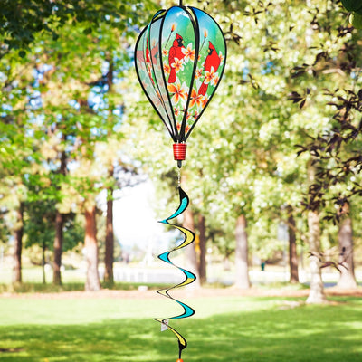 Vibrant Cardinal Hot Air Balloon spinner with cardinal and plumeria design, spinning gracefully in a garden setting to showcase its colorful features.