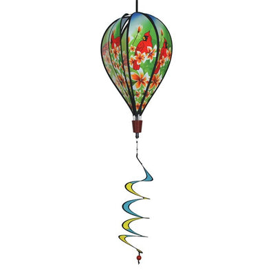 Vibrant Cardinal Hot Air Balloon spinner with cardinal and plumeria design, spinning gracefully in a garden setting to showcase its colorful features.