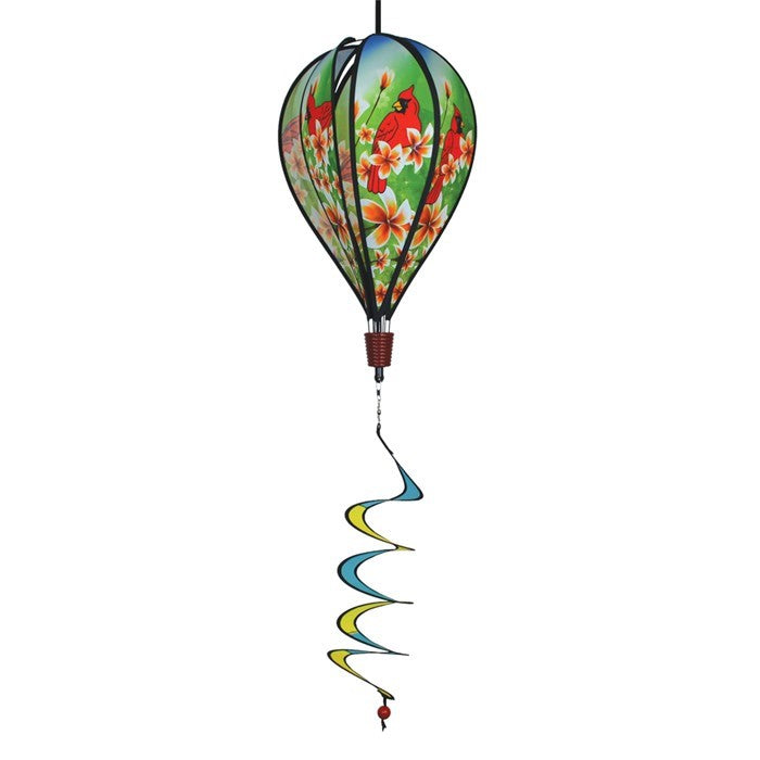 Vibrant Cardinal Hot Air Balloon spinner with cardinal and plumeria design, spinning gracefully in a garden setting to showcase its colorful features.