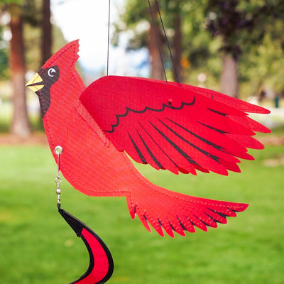 Cardinal Theme Twister featuring a vibrant red cardinal design with 3D wings, spinning in the wind against a clear sky backdrop.