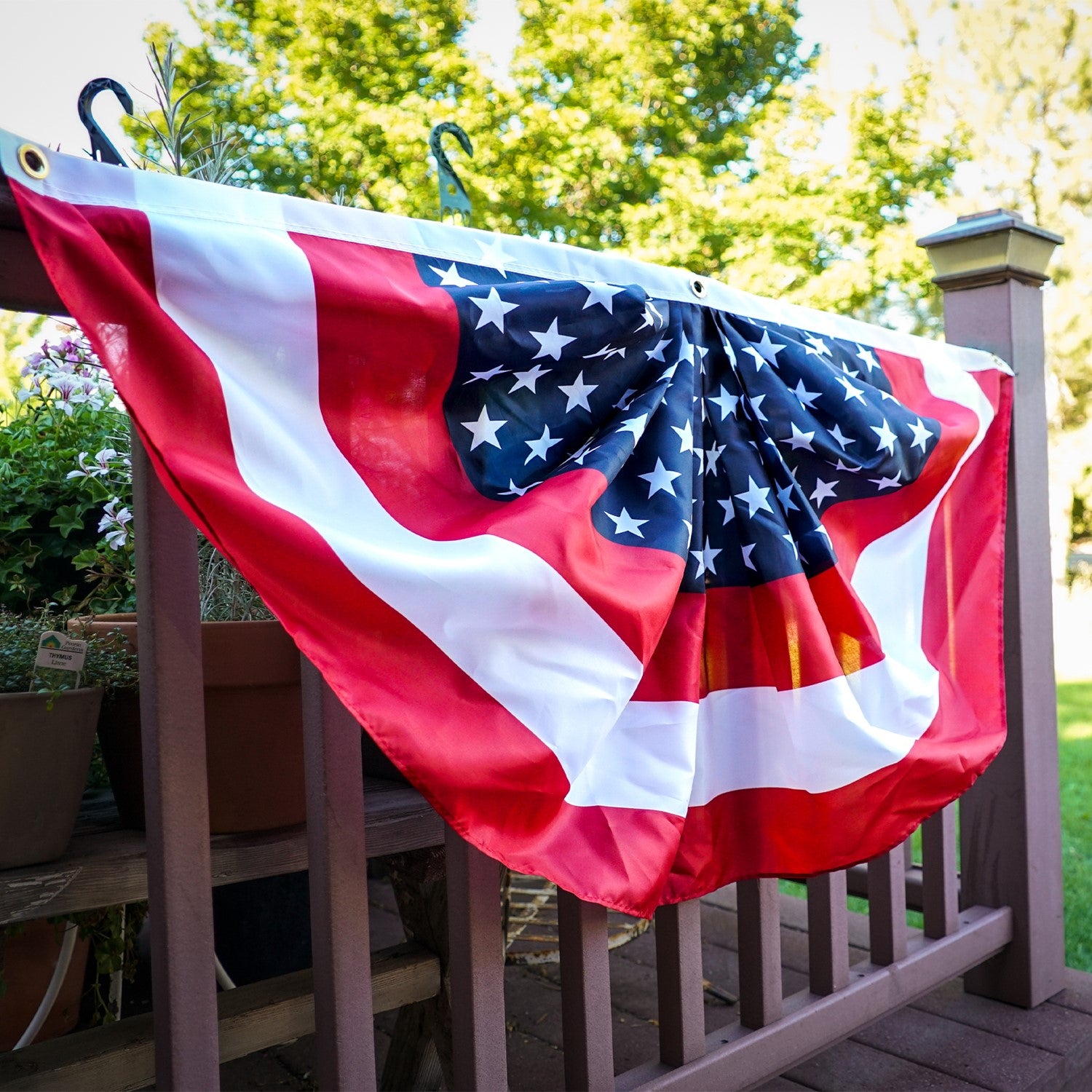 Center Stars Printed Bunting featuring U.S. flag colors in a pleated design, perfect for outdoor decorations during patriotic events.