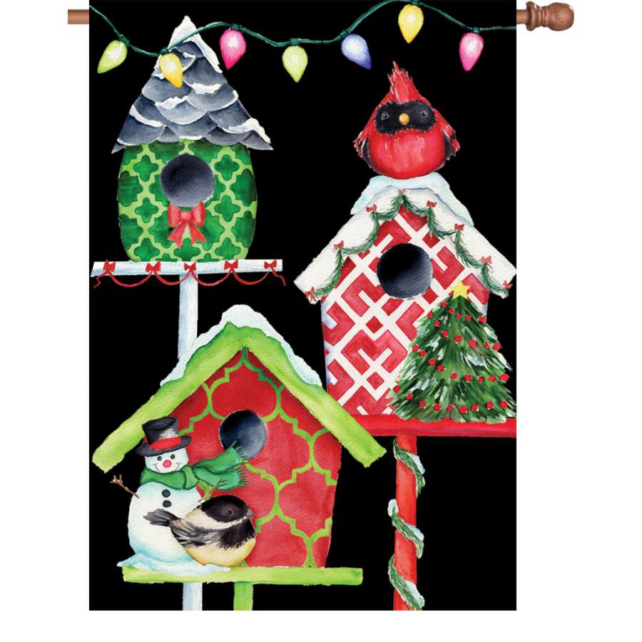 28 in. Christmas Birdhouses flag with colorful designs displayed outside, highlighting festive winter themes in a garden setting.