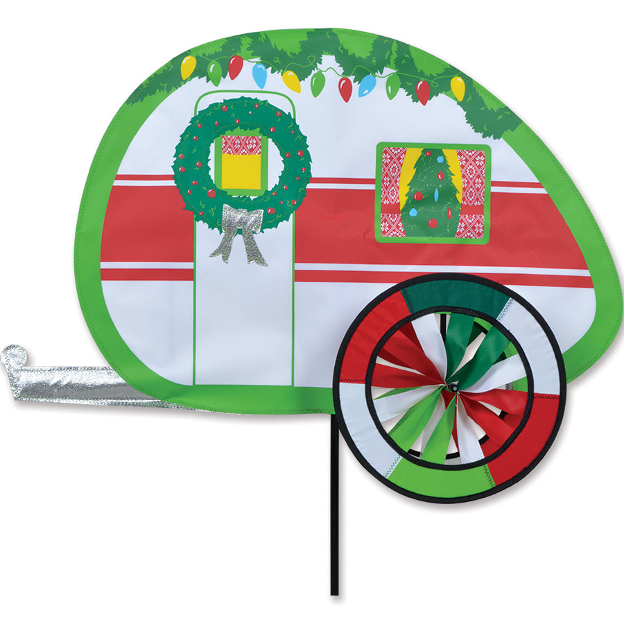 Colorful Christmas Camper Spinner displayed in a garden setting, featuring a vibrant camper design that twirls in the breeze.